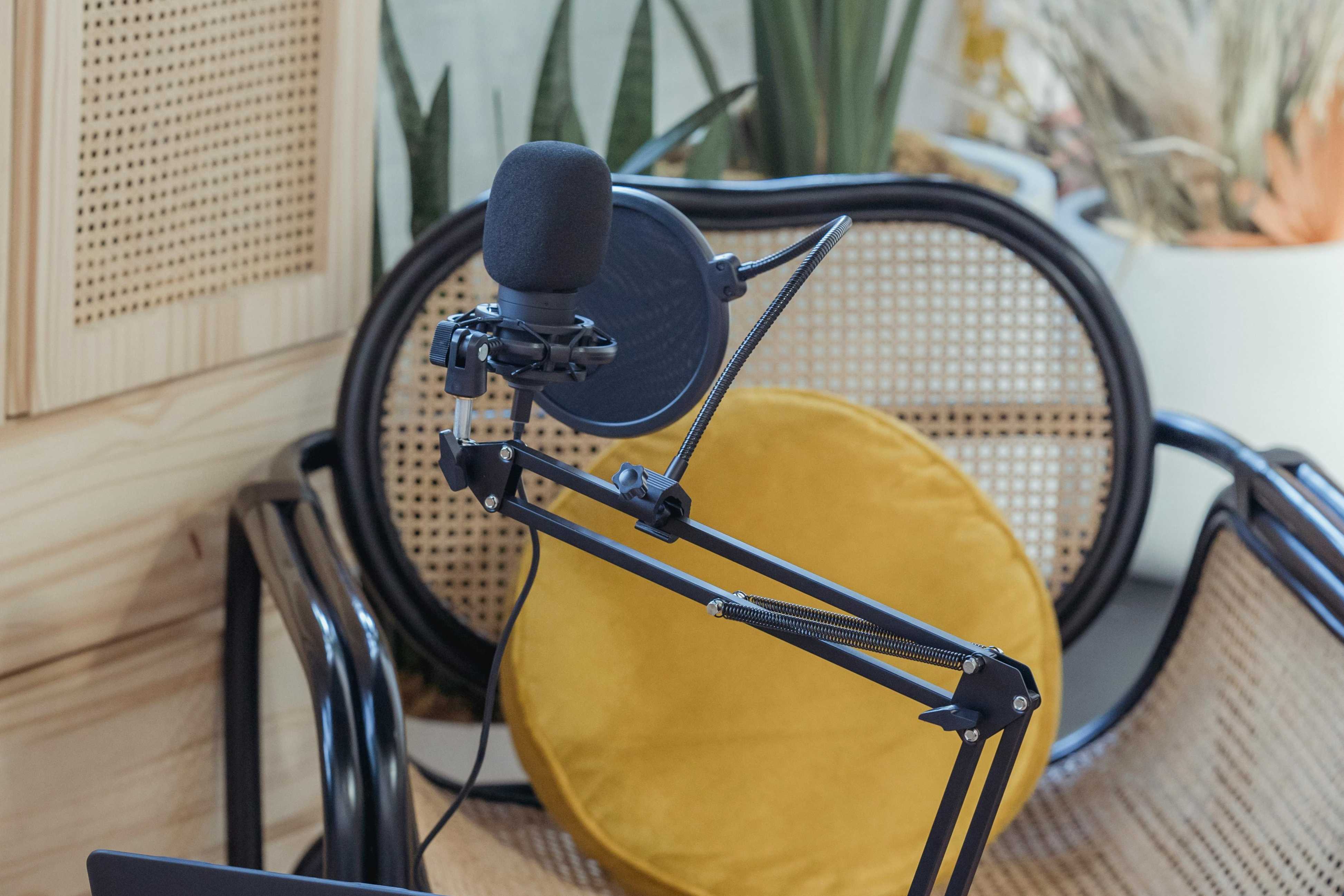 Laptop and microphone in front of a chair