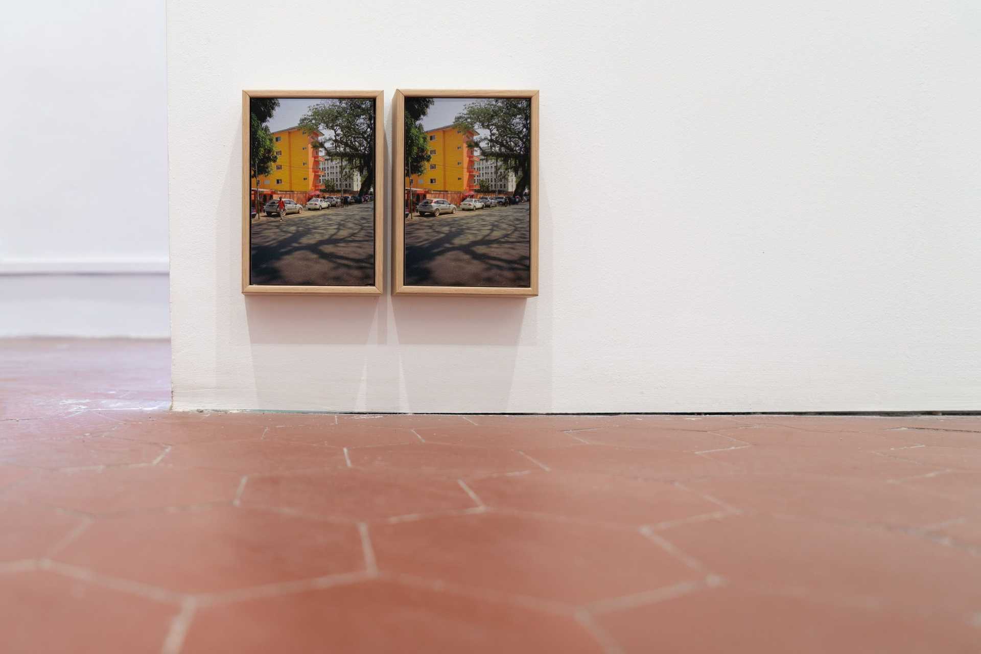 A room in Arles with the installation by the Institute Contemporary -two big pictures at a wall