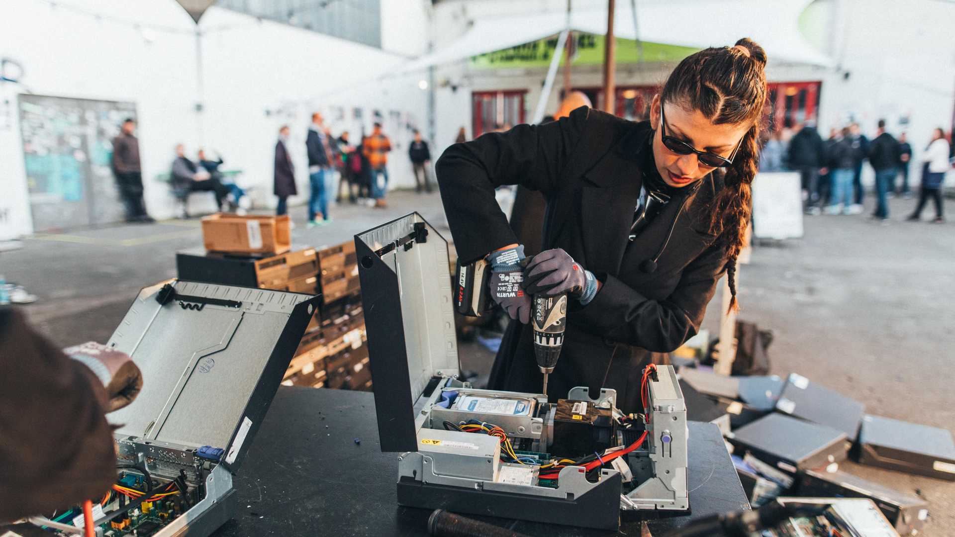 The artist is deconstructing motherboards during a exhibition