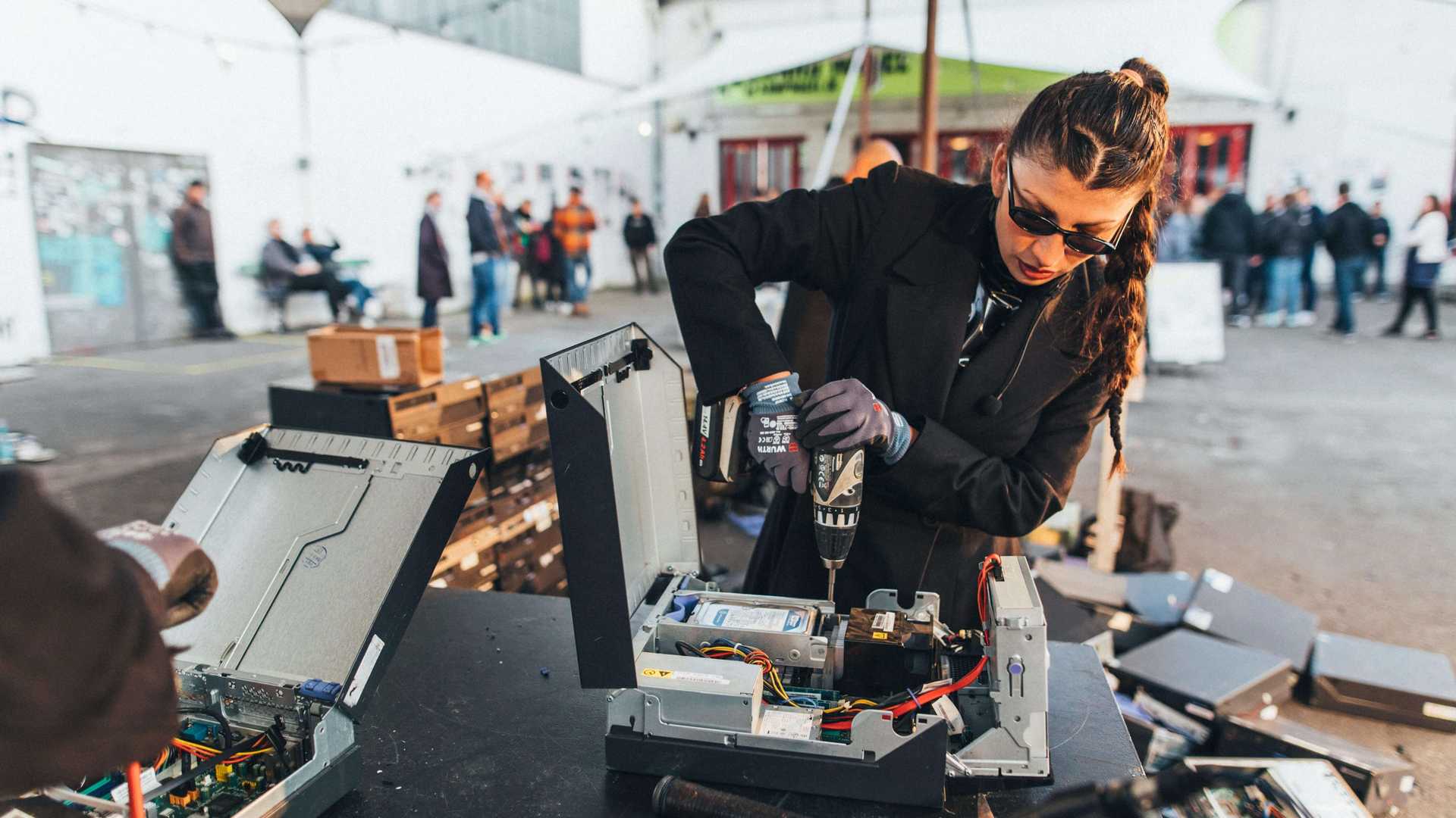 The artist is deconstructing motherboards during a exhibition