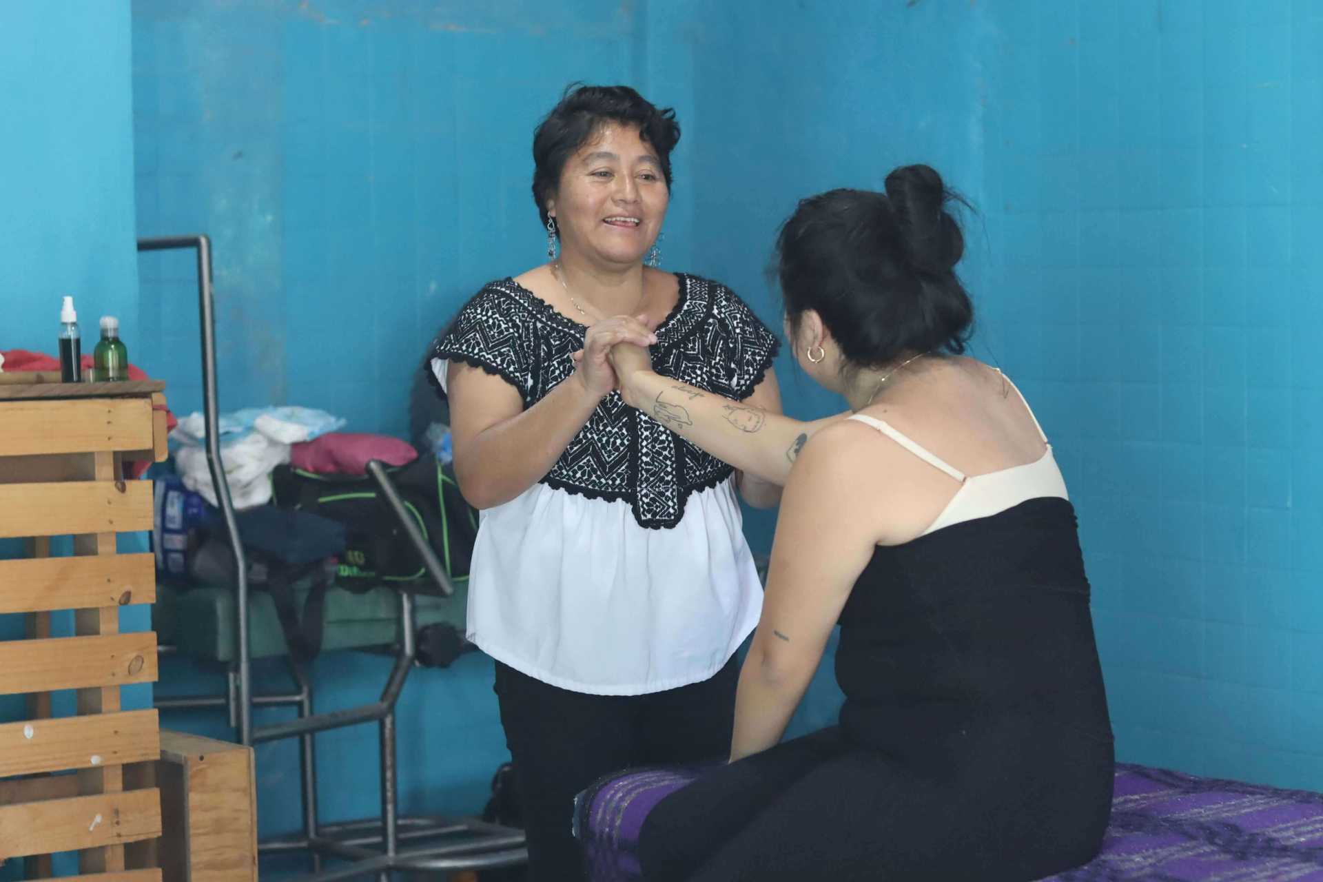 Amparo is treating a person in the treatment room