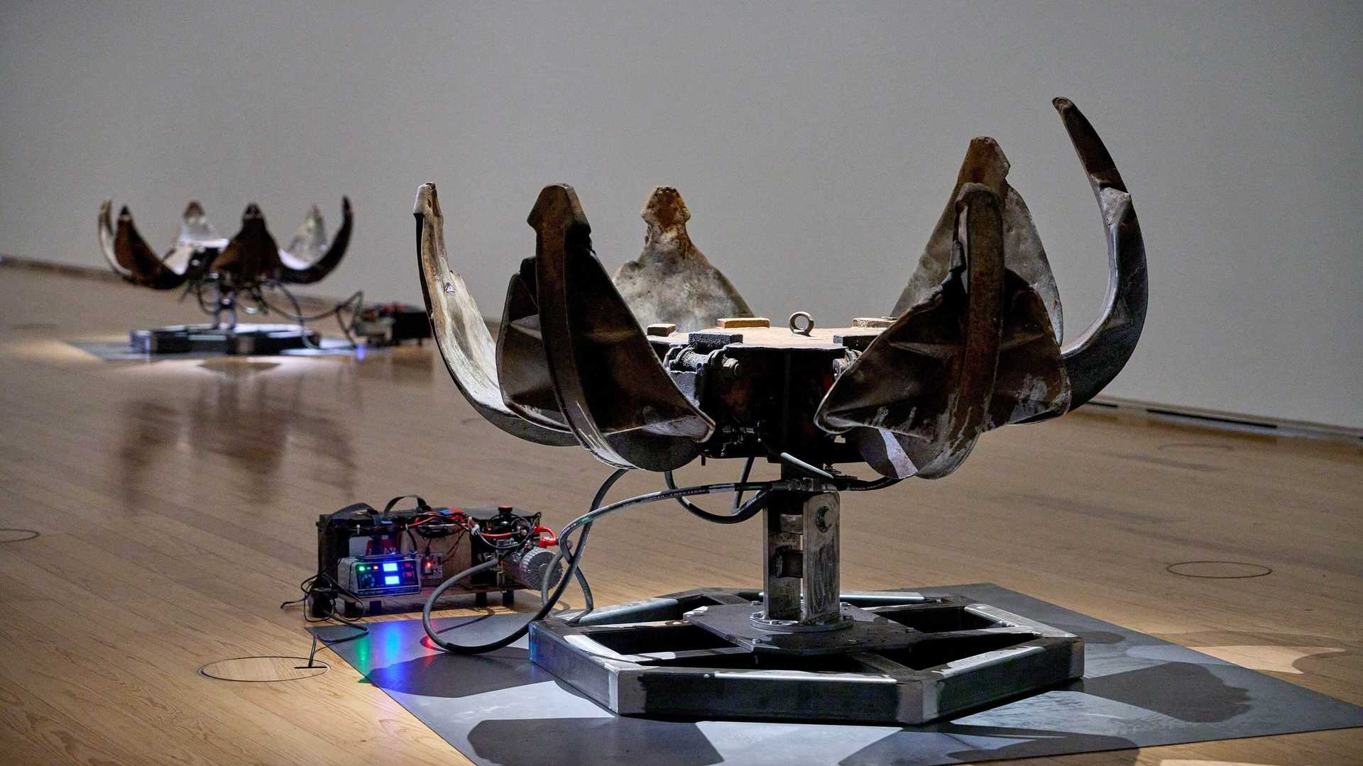 An exhibition with flowers made of car pieces