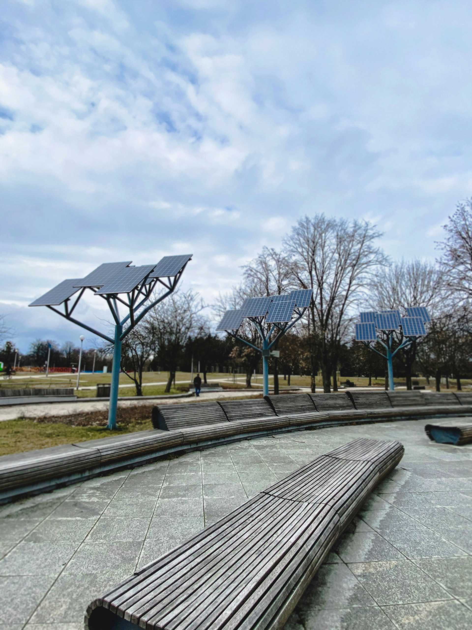 A park in Warsaw, Poland. There are long wooden branches and sun collectors installed in the park.