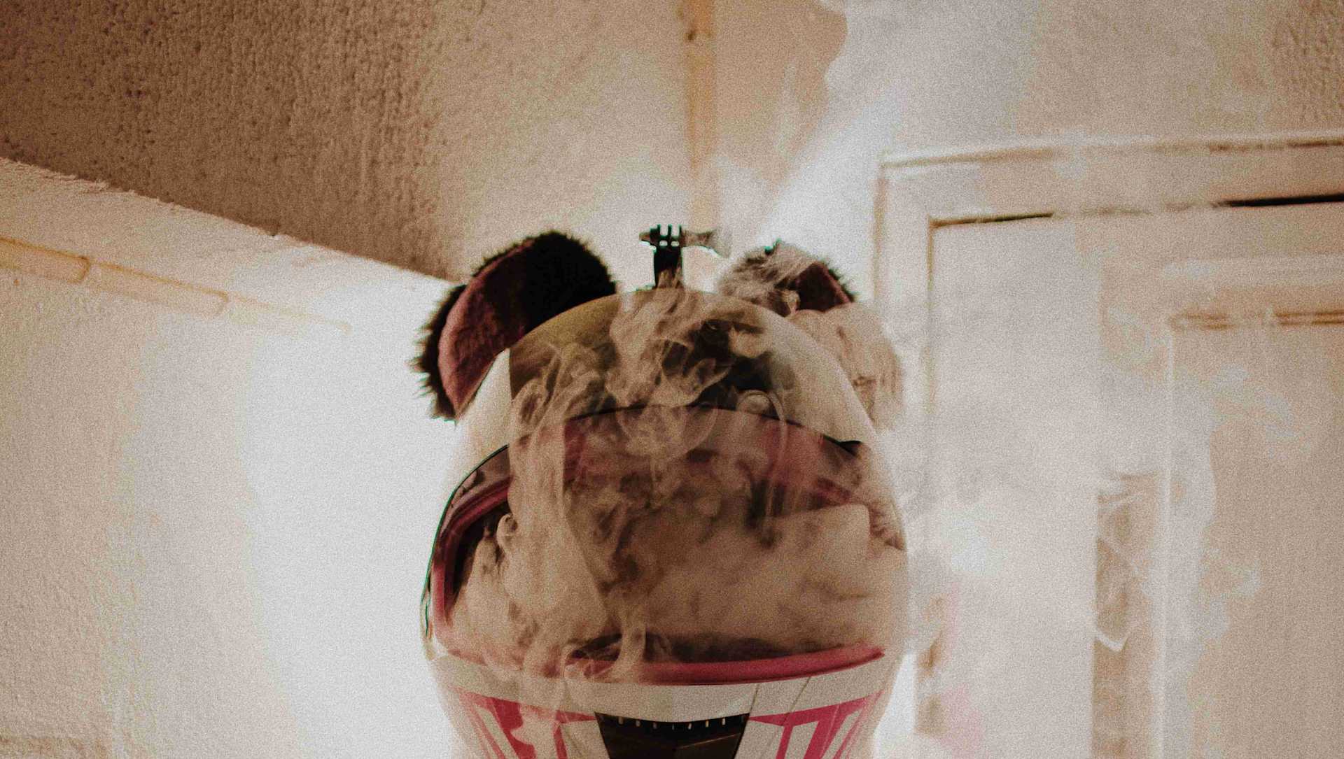 A man with a helmet that is filled with smoke